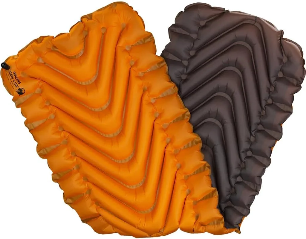 Two Klymit Insulated Static V Lite inflatable sleeping pads, orange and grey, shown on a plain background.