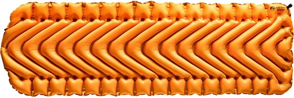 An orange Klymit Insulated Static V Lite inflatable sleeping pad, shown inflated on a plain background.